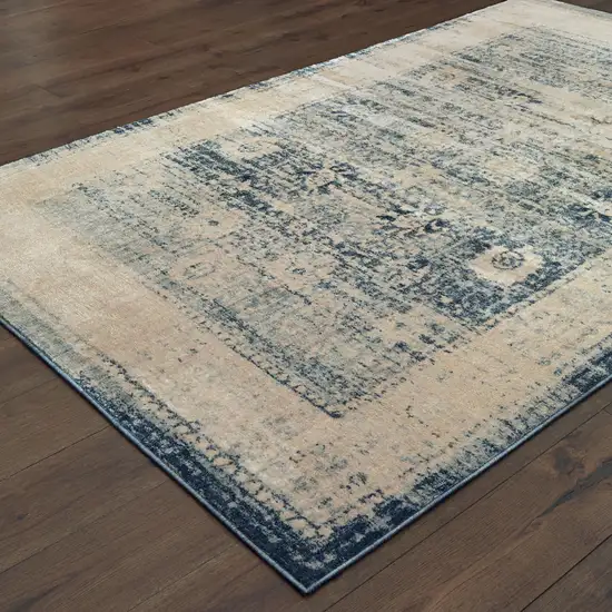 Ivory And Blue Oriental Power Loom Stain Resistant Area Rug Photo 4