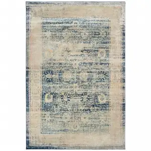 Photo of Ivory And Blue Oriental Power Loom Stain Resistant Area Rug