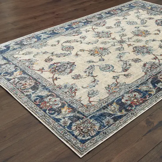 Ivory And Blue Oriental Power Loom Stain Resistant Area Rug Photo 4