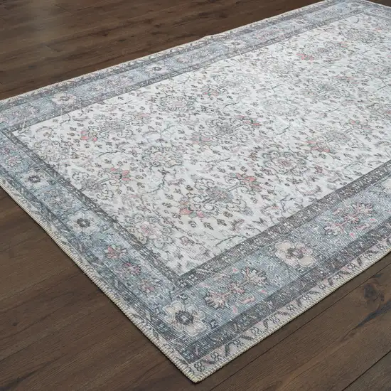 Ivory And Blue Oriental Power Loom Stain Resistant Area Rug Photo 4