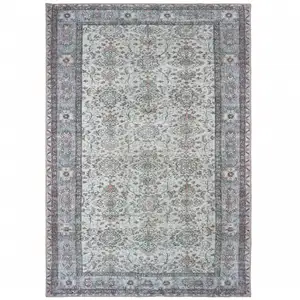 Photo of Ivory And Blue Oriental Power Loom Stain Resistant Area Rug