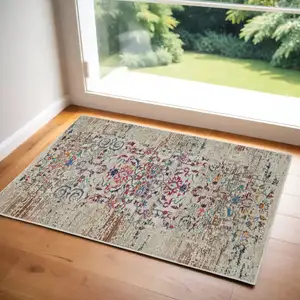 Photo of Ivory And Brown Floral Distressed Area Rug