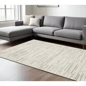 Photo of Ivory And Brown Striped Distressed Area Rug