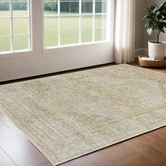 Ivory And Gold Floral Stain Resistant Area Rug Photo 1