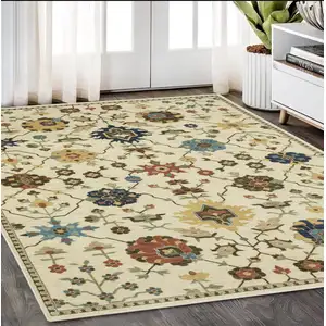 Photo of Ivory And Gold Oriental Area Rug With Fringe