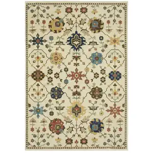 Photo of Ivory And Gold Oriental Area Rug With Fringe