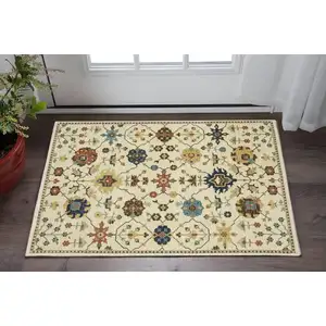 Photo of Ivory And Gold Oriental Area Rug With Fringe