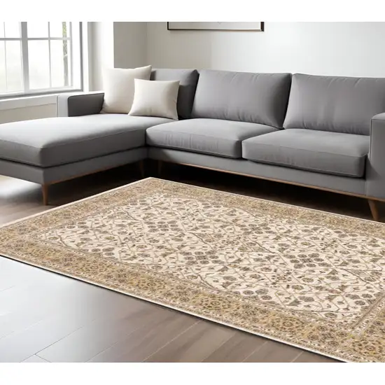 Gold and Ivory Oriental Power Loom Area Rug With Fringe Photo 1