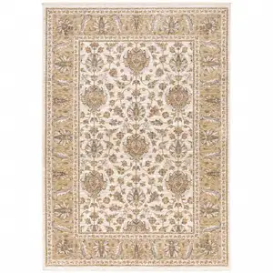 Photo of Ivory And Gold Oriental Power Loom Stain Resistant Area Rug With Fringe