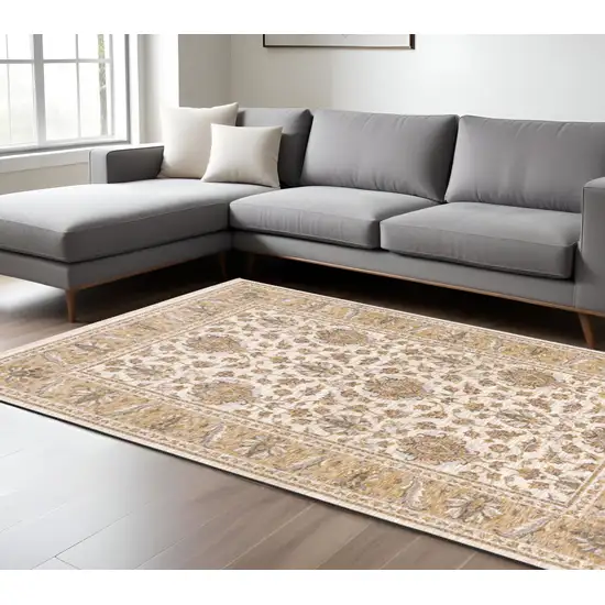 Gold and Ivory Oriental Power Loom Area Rug With Fringe Photo 1