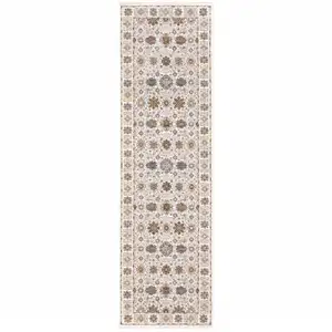 Photo of Ivory And Gold Oriental Power Loom Stain Resistant Runner Rug With Fringe