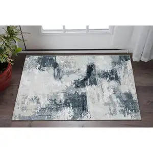 Photo of Ivory And Gray Abstract Distressed Area Rug