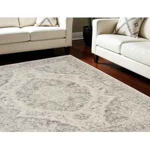 Photo of Ivory And Gray Floral Medallion Distressed Area Rug