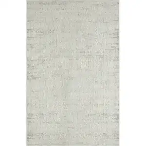 Photo of Ivory And Gray Floral Power Loom Distressed Stain Resistant Area Rug