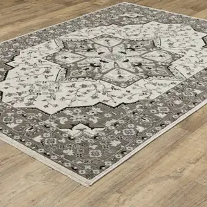 Photo of Ivory And Gray Medallion Area Rug With Fringe