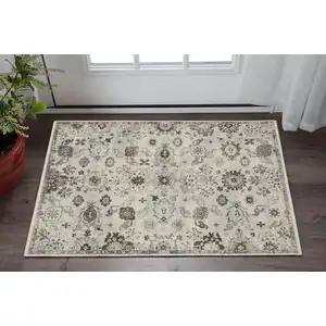 Photo of Ivory And Gray Oriental Area Rug With Fringe