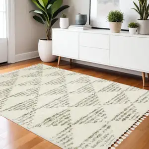 Photo of Ivory And Green Geometric Shag Area Rug With Fringe