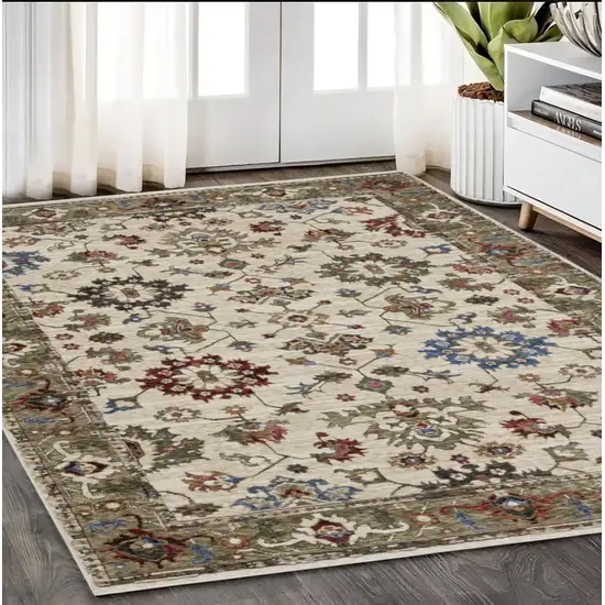 Ivory And Green Oriental Area Rug With Fringe Photo 1