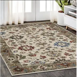 Photo of Ivory And Green Oriental Area Rug With Fringe