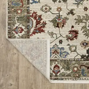 Photo of Ivory And Green Oriental Area Rug With Fringe