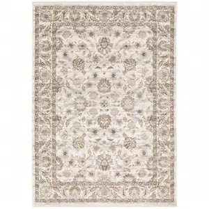 Photo of Ivory And Grey Oriental Power Loom Stain Resistant Area Rug With Fringe