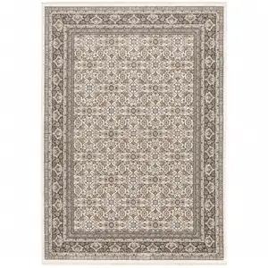 Photo of Ivory And Grey Oriental Power Loom Stain Resistant Area Rug With Fringe