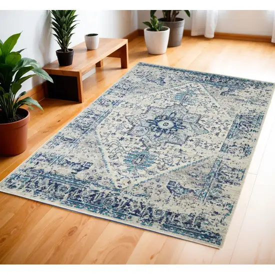 Ivory And Light Blue Floral Medallion Distressed Area Rug Photo 1