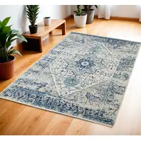 Photo of Ivory And Light Blue Floral Medallion Distressed Area Rug