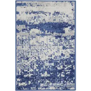 Photo of Ivory And Navy Blue Abstract Area Rug