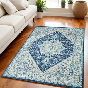 Photo of Ivory And Navy Blue Floral Medallion Distressed Area Rug