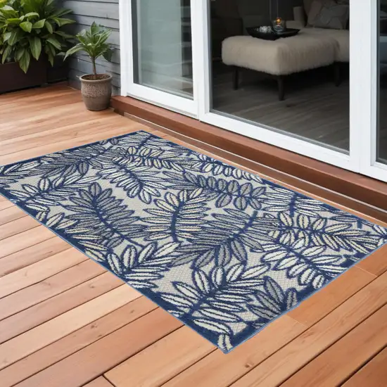 Ivory And Navy Floral Non Skid Indoor Outdoor Area Rug Photo 1