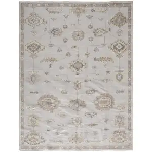 Photo of Ivory And Orange Floral Hand Knotted Stain Resistant Area Rug