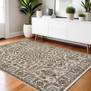 Photo of Ivory And Rust Floral Area Rug With Fringe