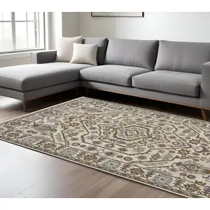 Photo of Ivory And Rust Floral Area Rug With Fringe