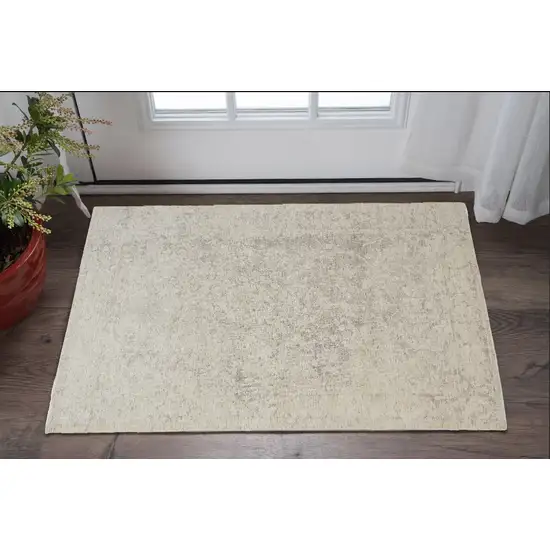 Ivory And Tan Abstract Hand Woven Area Rug Photo 1