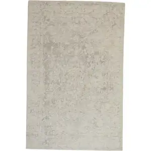 Photo of Ivory And Tan Abstract Hand Woven Area Rug