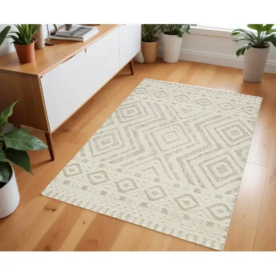 Ivory And Tan Wool Geometric Tufted Handmade Stain Resistant Area Rug Photo 1