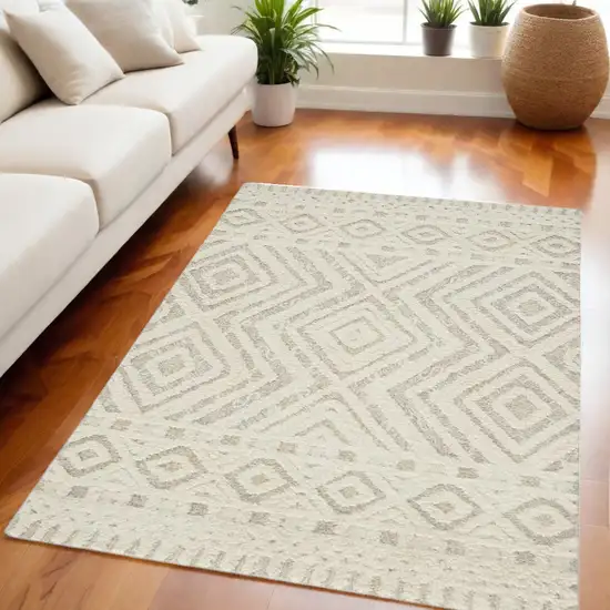 Ivory And Tan Wool Geometric Tufted Handmade Stain Resistant Area Rug Photo 1