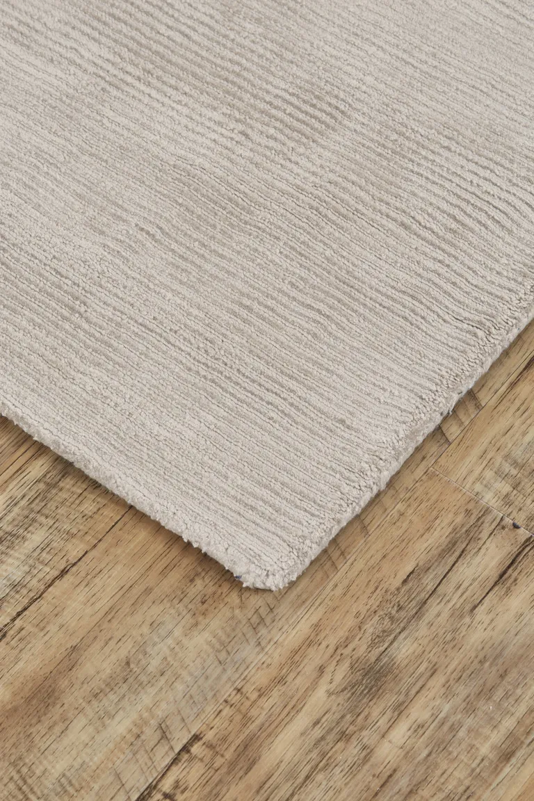 Ivory And Taupe Hand Woven Distressed Area Rug Photo 3