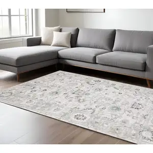 Photo of Ivory And Teal Blue Oriental Hand Tufted Area Rug