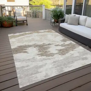 Photo of Ivory Beige And Brown Abstract Washable Indoor Outdoor Area Rug