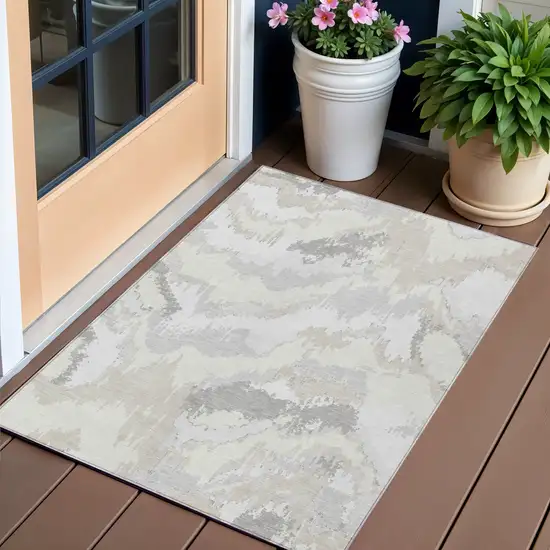 Ivory Beige And Cream Abstract Washable Indoor Outdoor Area Rug Photo 1