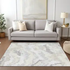 Photo of Ivory Beige And Cream Abstract Washable Indoor Outdoor Area Rug