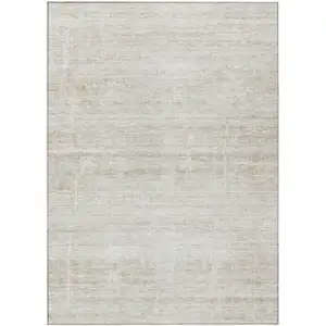 Photo of Ivory Beige And Tan Abstract Washable Indoor Outdoor Area Rug