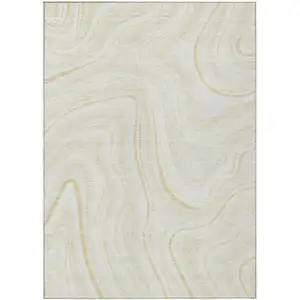 Photo of Ivory Beige And Tan Abstract Washable Indoor Outdoor Area Rug