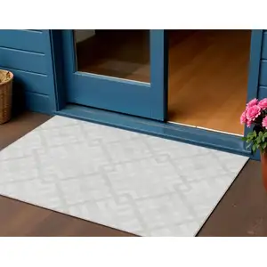 Photo of Ivory Beige And Tan Geometric Washable Indoor Outdoor Area Rug