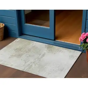 Photo of Ivory Beige And Taupe Abstract Washable Indoor Outdoor Area Rug