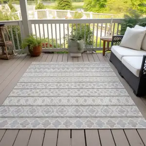 Photo of Ivory Beige And Taupe Quatrefoil Washable Indoor Outdoor Area Rug