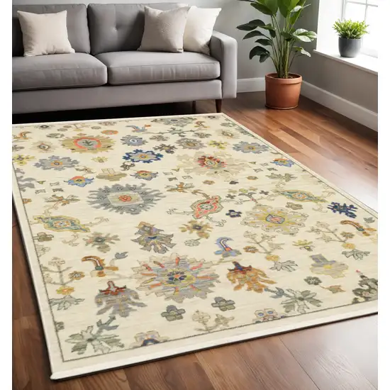 Beige and Ivory Oriental Power Loom Area Rug With Fringe Photo 1