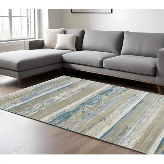 Ivory Beige Grey Blue And Tan Abstract Power Loom Stain Resistant Area Rug With Fringe Photo 1